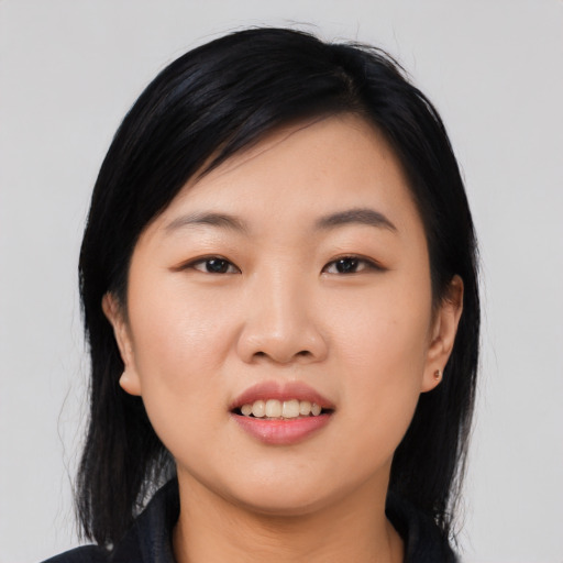 Joyful asian young-adult female with medium  black hair and brown eyes