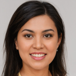 Joyful white young-adult female with long  brown hair and brown eyes