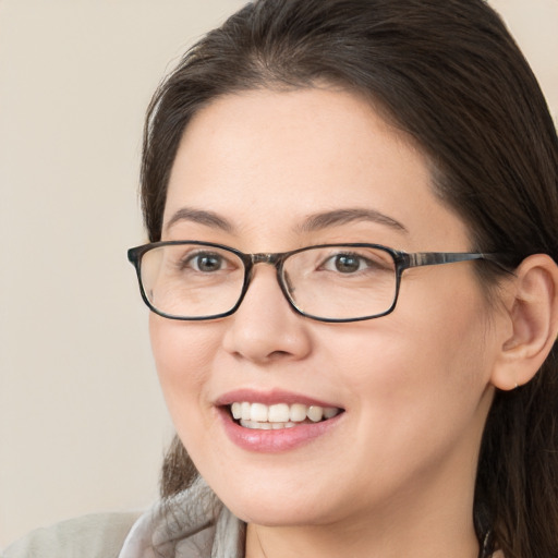 Joyful white young-adult female with medium  brown hair and brown eyes