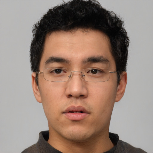 Neutral white young-adult male with short  black hair and brown eyes