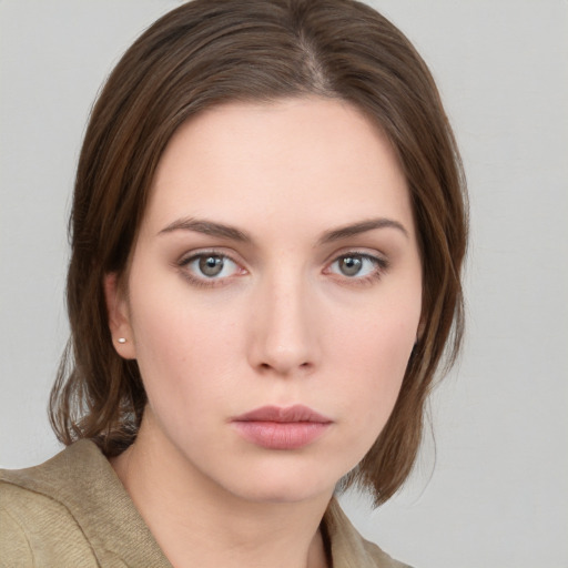 Neutral white young-adult female with medium  brown hair and green eyes