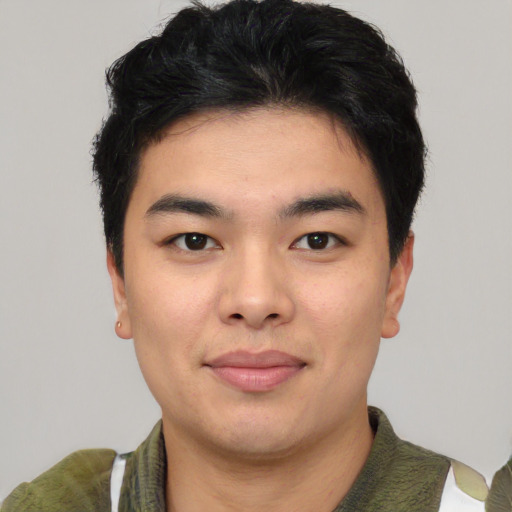Joyful asian young-adult male with short  black hair and brown eyes