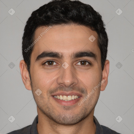 Joyful white young-adult male with short  black hair and brown eyes