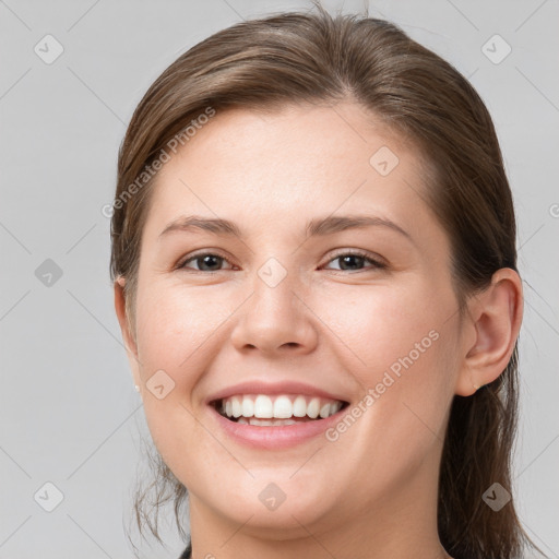 Joyful white young-adult female with medium  brown hair and grey eyes