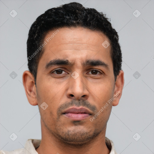 Neutral latino young-adult male with short  black hair and brown eyes