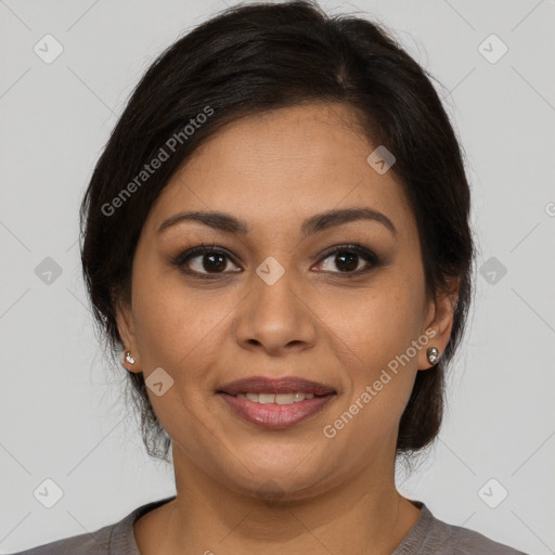 Joyful latino young-adult female with medium  brown hair and brown eyes