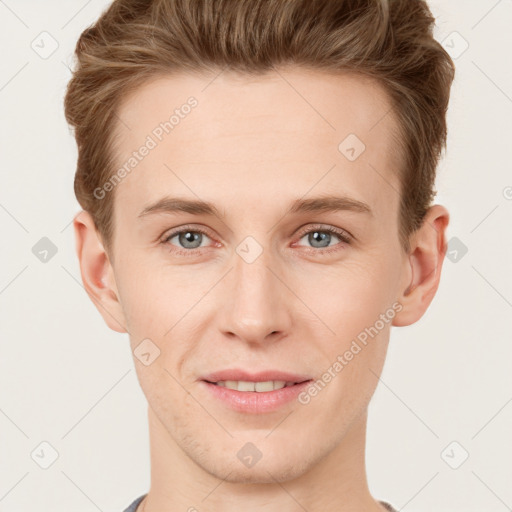 Joyful white young-adult male with short  brown hair and grey eyes