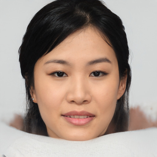 Joyful asian young-adult female with medium  black hair and brown eyes