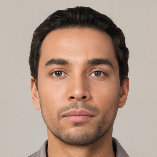 Neutral latino young-adult male with short  black hair and brown eyes