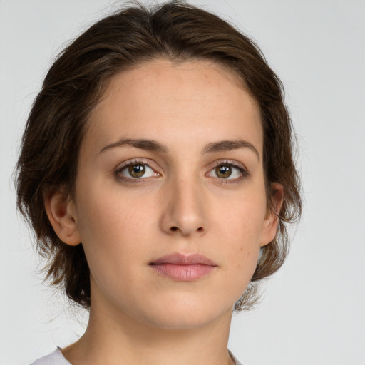 Neutral white young-adult female with medium  brown hair and green eyes