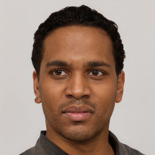 Neutral black young-adult male with short  black hair and brown eyes