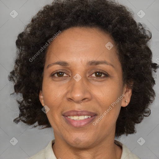 Joyful black adult female with medium  brown hair and brown eyes