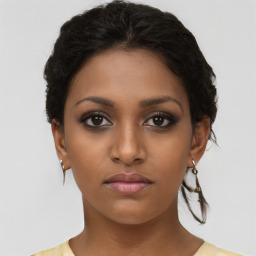 Neutral black young-adult female with short  brown hair and brown eyes