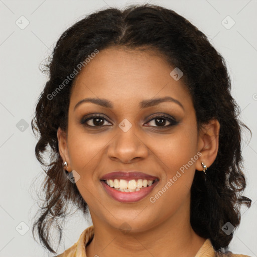 Joyful black young-adult female with long  brown hair and brown eyes