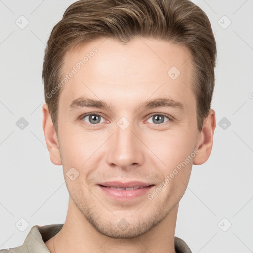 Joyful white young-adult male with short  brown hair and grey eyes