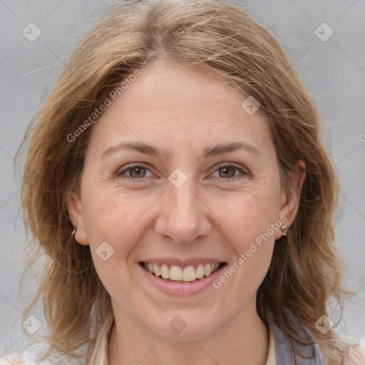 Joyful white adult female with medium  brown hair and grey eyes