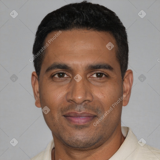 Joyful black young-adult male with short  black hair and brown eyes