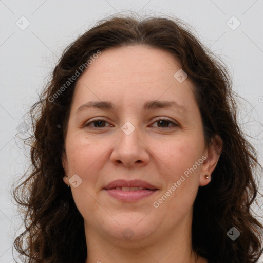 Joyful white adult female with long  brown hair and brown eyes