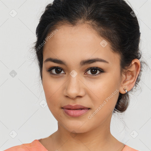 Joyful latino young-adult female with medium  brown hair and brown eyes