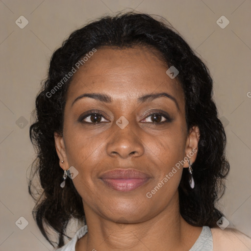 Joyful black adult female with medium  brown hair and brown eyes