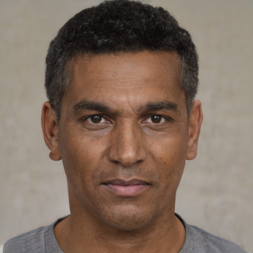 Neutral black adult male with short  black hair and brown eyes