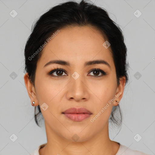 Joyful latino young-adult female with medium  brown hair and brown eyes