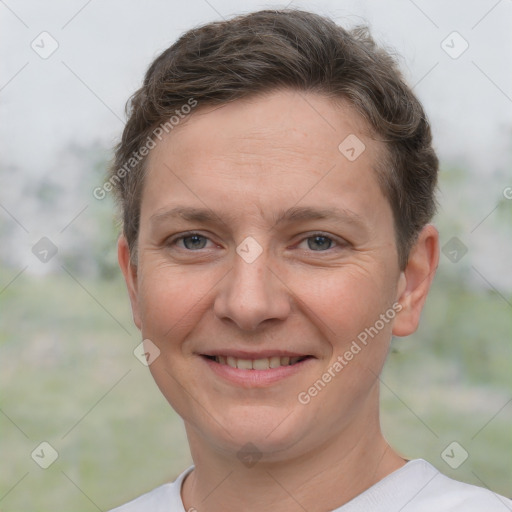 Joyful white adult female with short  brown hair and brown eyes