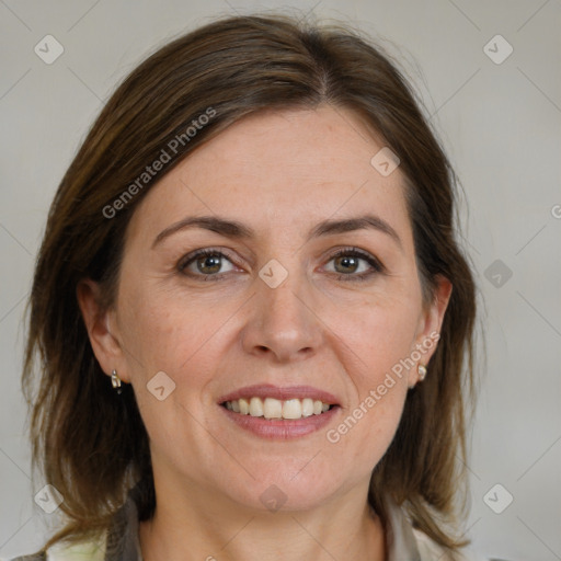 Joyful white adult female with medium  brown hair and brown eyes