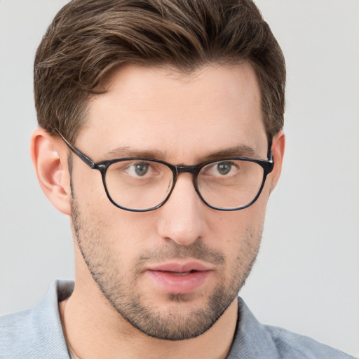 Neutral white adult male with short  brown hair and grey eyes