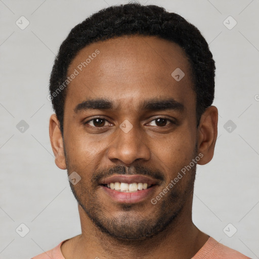 Joyful black young-adult male with short  black hair and brown eyes