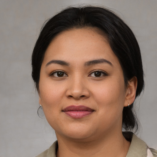 Joyful asian young-adult female with medium  brown hair and brown eyes