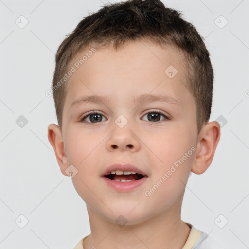 Joyful white child male with short  brown hair and brown eyes