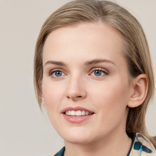 Joyful white young-adult female with medium  brown hair and blue eyes