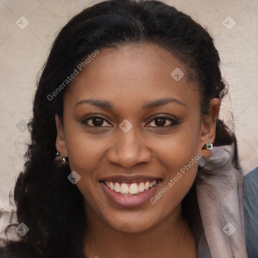 Joyful black young-adult female with long  brown hair and brown eyes