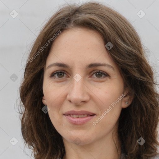 Joyful white adult female with long  brown hair and brown eyes