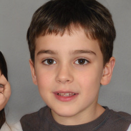 Joyful white child male with short  brown hair and brown eyes