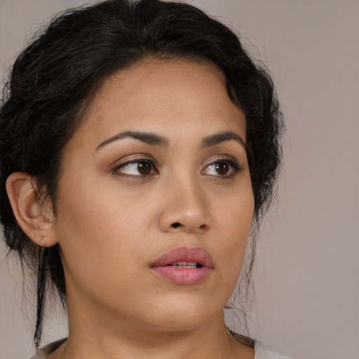 Neutral latino young-adult female with medium  brown hair and brown eyes