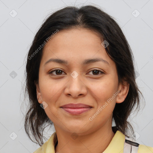 Joyful latino young-adult female with medium  brown hair and brown eyes