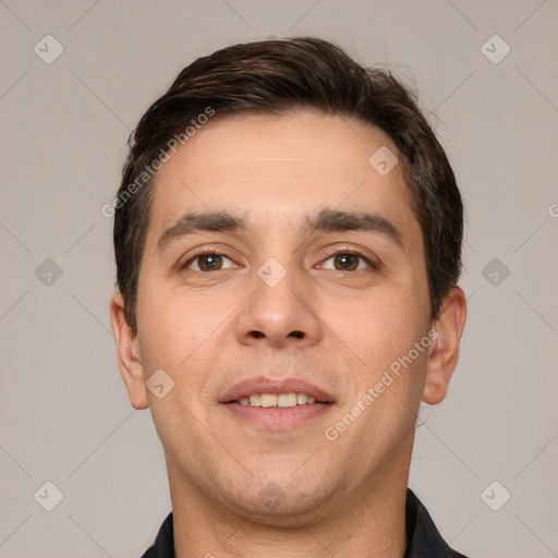 Joyful white young-adult male with short  brown hair and brown eyes