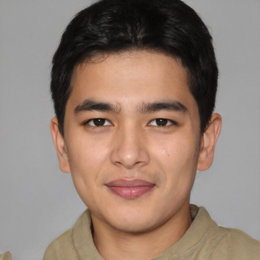 Joyful asian young-adult male with short  brown hair and brown eyes