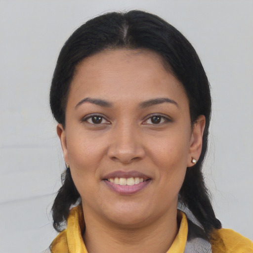 Joyful asian young-adult female with medium  black hair and brown eyes