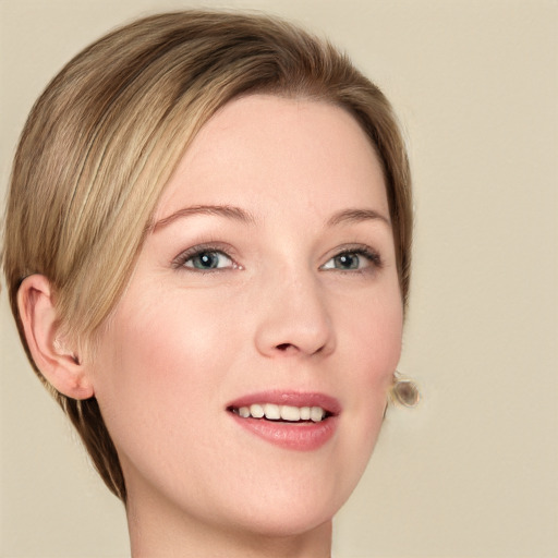 Joyful white young-adult female with medium  brown hair and green eyes