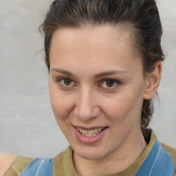 Joyful white adult female with short  brown hair and brown eyes