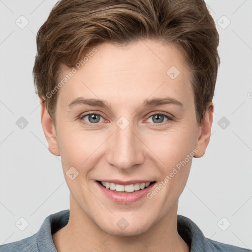 Joyful white young-adult female with short  brown hair and grey eyes