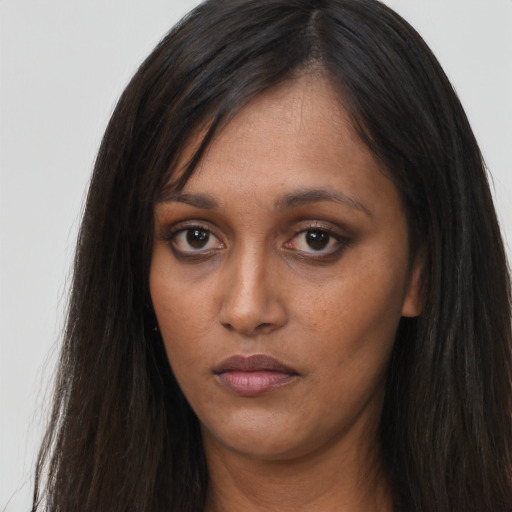 Neutral asian young-adult female with long  brown hair and brown eyes