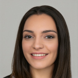 Joyful white young-adult female with long  black hair and brown eyes