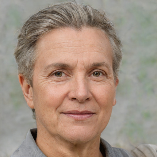 Joyful white middle-aged male with short  gray hair and brown eyes