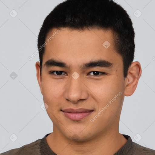 Joyful latino young-adult male with short  brown hair and brown eyes