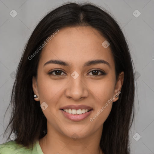 Joyful latino young-adult female with long  brown hair and brown eyes