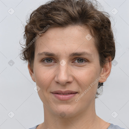 Joyful white adult female with short  brown hair and grey eyes